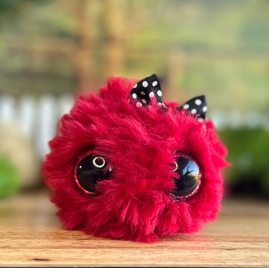 Red, the sparkly monster (with bow!)